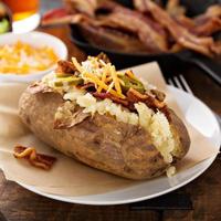 Loaded baked potato with bacon and cheese photo