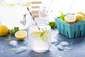 Fresh citrus lemonade in beverage dispenser photo
