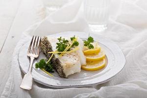 Grilled stripped bass with lemon and herbs photo