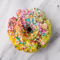 Unicorn donut on marble surface photo