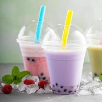 Variety of bubble tea in plastic cups photo