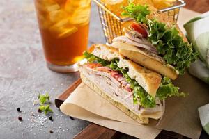 Turkey sandwich with cheese and herb mayonnaise photo