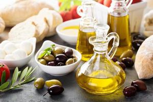 Mediterranean cuisine with olive oil, cheese and bread photo