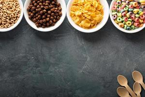 Variety of cold cereals in white bowls photo