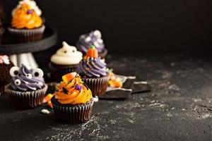 Festive Halloween cupcakes and treats photo