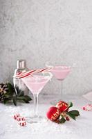 Peppermint martini cocktail with coconut flakes rim photo