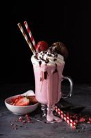 Strawberry milkshake with whipped cream photo