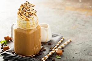 Caramel iced latte with whipped cream photo