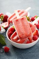 Strawberry and raspberry popsicles photo