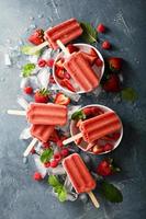 Strawberry and raspberry popsicles photo