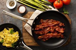 Cooked bacon on a skillet photo