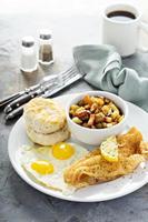 Fried fish breakfast with sunny side up eggs photo
