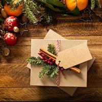 Christmas present with oranges, candy canes and decorations photo
