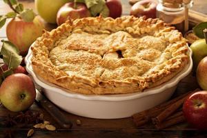 Apple pie decorated with fall leaves photo