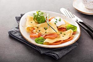 Savory crepes with salmon filling photo