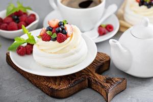 Pavlova cakes with cream and fresh berries photo