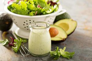 Avocado ranch dressing in small jar photo