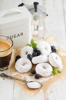 Small donuts in powdered sugar photo