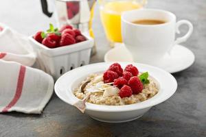Steel cut oatmeal porridge with raspberry and coconut