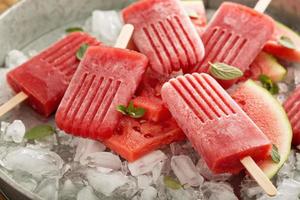 Watermelon and strawberry popsicles photo
