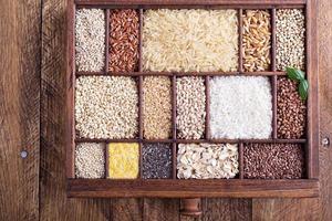 Variety of healthy grains and seeds in a wooden box photo