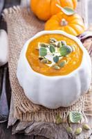 Pumpkin soup in a bowl photo