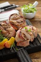 Grilled turkey tenderloins with bacon photo