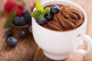 Chocolate pudding with cocoa and berries photo