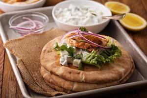 Chicken pita sandwich with cucumber sauce photo