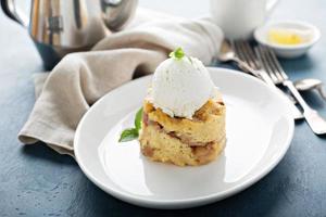 Apple bread pudding with vanilla ice cream photo