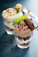 Individual desserts in glasses photo