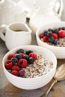 Quinoa porridge with raspberry and blueberry photo