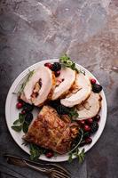 Roasted pork loin stuffed with apple and cranberry photo