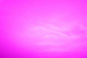 Defocus blurred transparent purple colored clear calm water surface texture with splashes and bubbles. Trendy abstract nature background. Water waves in sunlight with copy space. Pink water drop shine photo