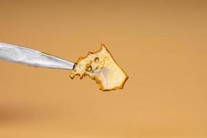 cannabis butane extraction, golden shatter with high thc content photo