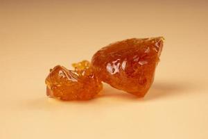 brown wax piece with high THC on beige background photo