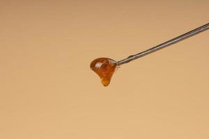 cannabis live resin on dab stick with high thc photo