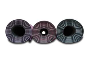 Close up colorful yoga mat isolated on white background photo