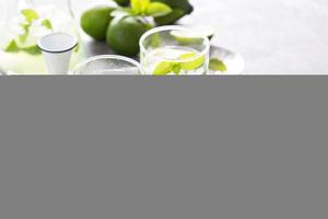 Refreshing cold cocktail with mint and limes photo