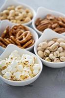 Variety of healthy snacks in white bowls photo