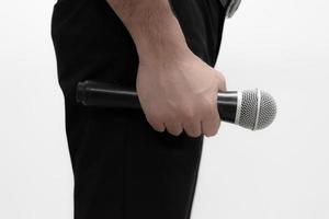 Man with microphone on white background photo