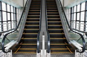 Escalators in an office building. Empty escalator stairs photo