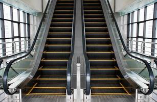 Escalators in an office building. Empty escalator stairs photo