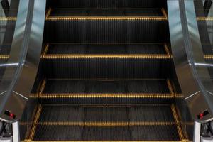 Escalators in an office building. Empty escalator stairs photo