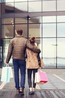 Young couple shopping in the city photo