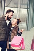 Young couple shopping in the city photo