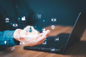 Businessman working at cloud data icon, cloud computing diagram show on hand. Cloud technology. Data storage. Networking and internet service concept. photo