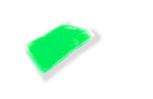 green jelly in pack on white background photo