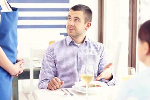 Unhappy customer in a restaurant photo