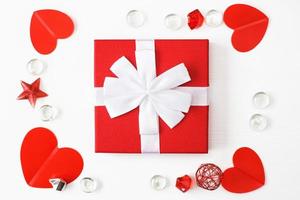 gift box with red hearts on a white background. greeting card photo